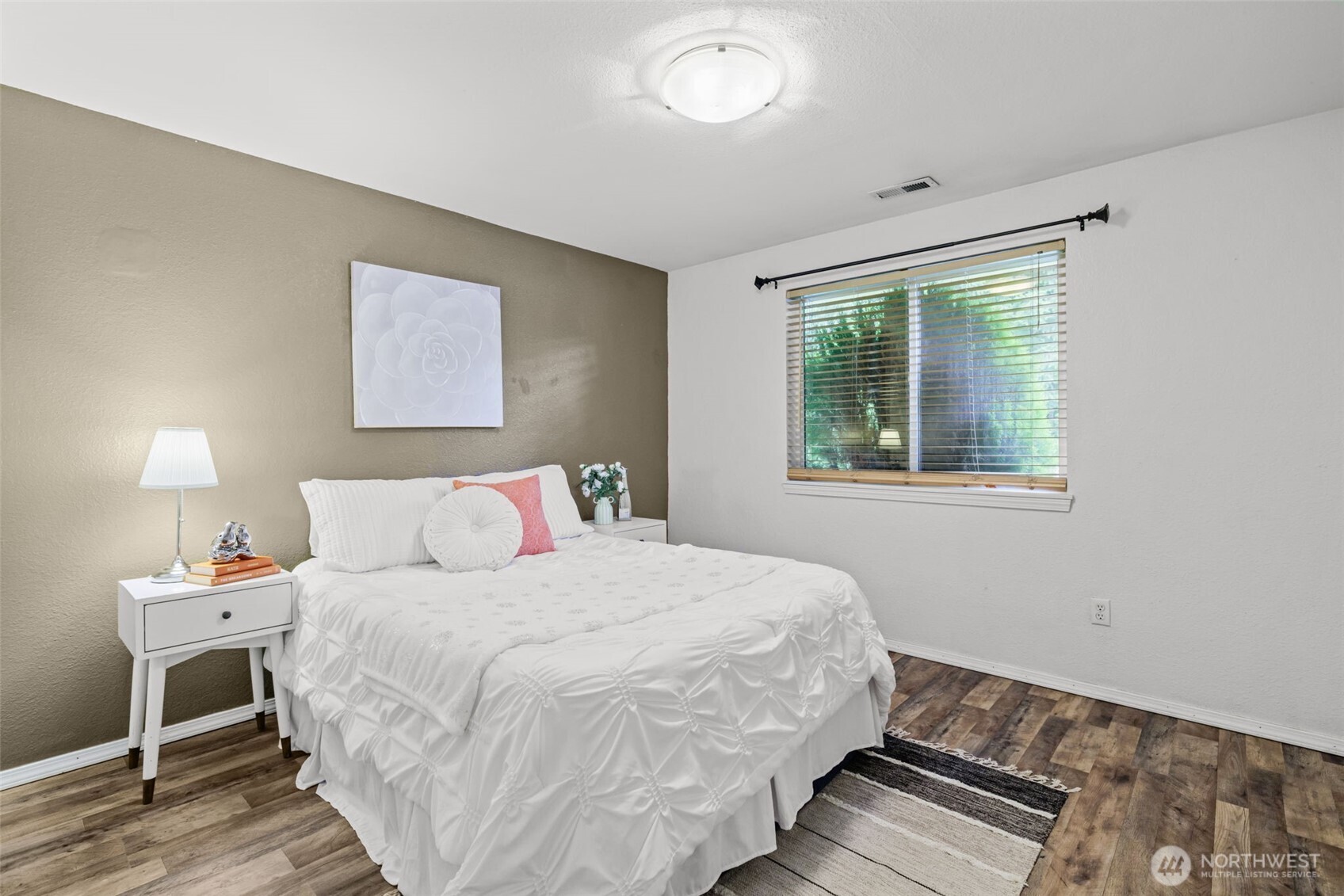 19221 Patterson Road East Orting, WA 98360 - Photo 21 of 40 a bedroom with a bed and a window