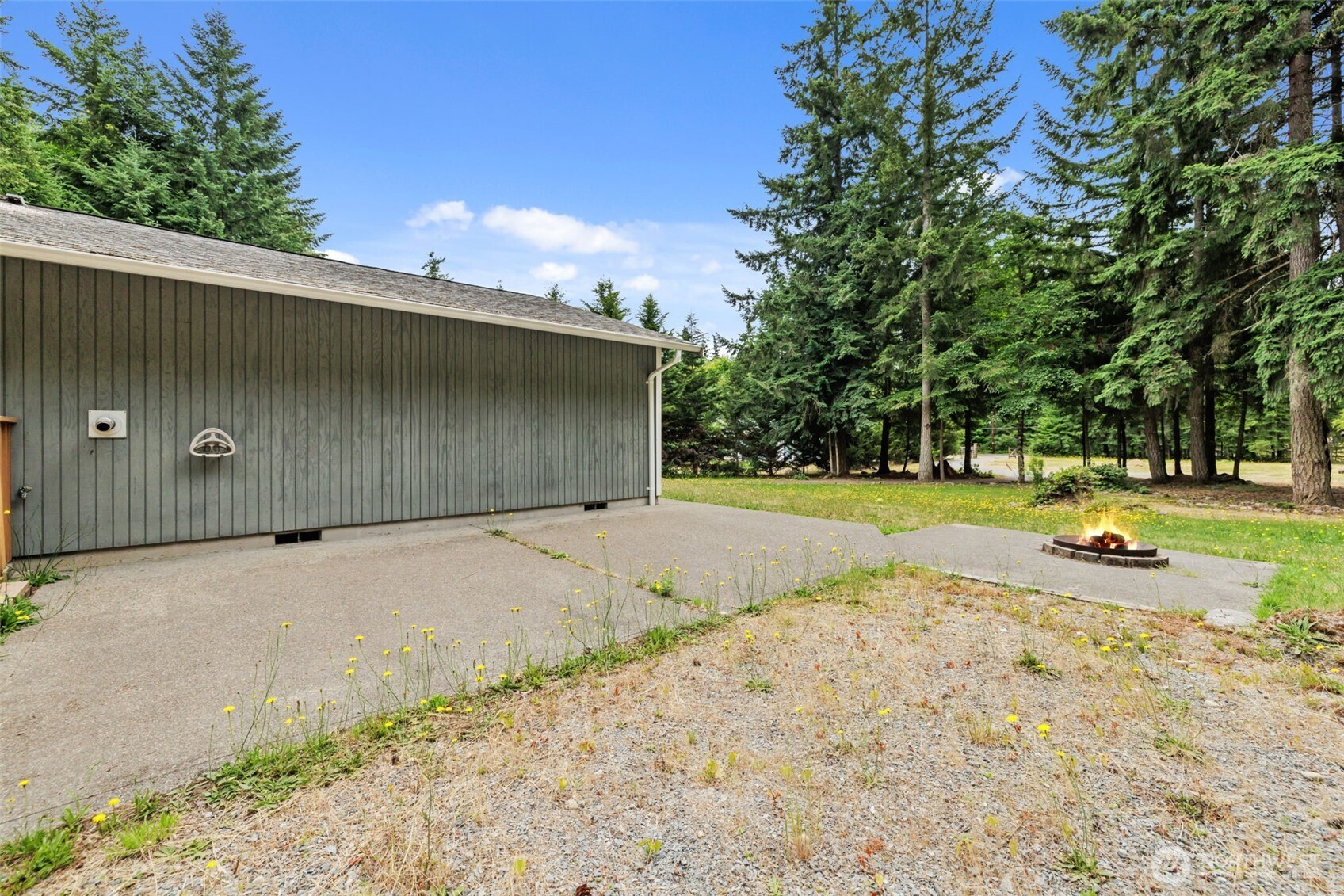 19221 Patterson Road East Orting, WA 98360 - Photo 30 of 40 a view of a swimming pool with a yard