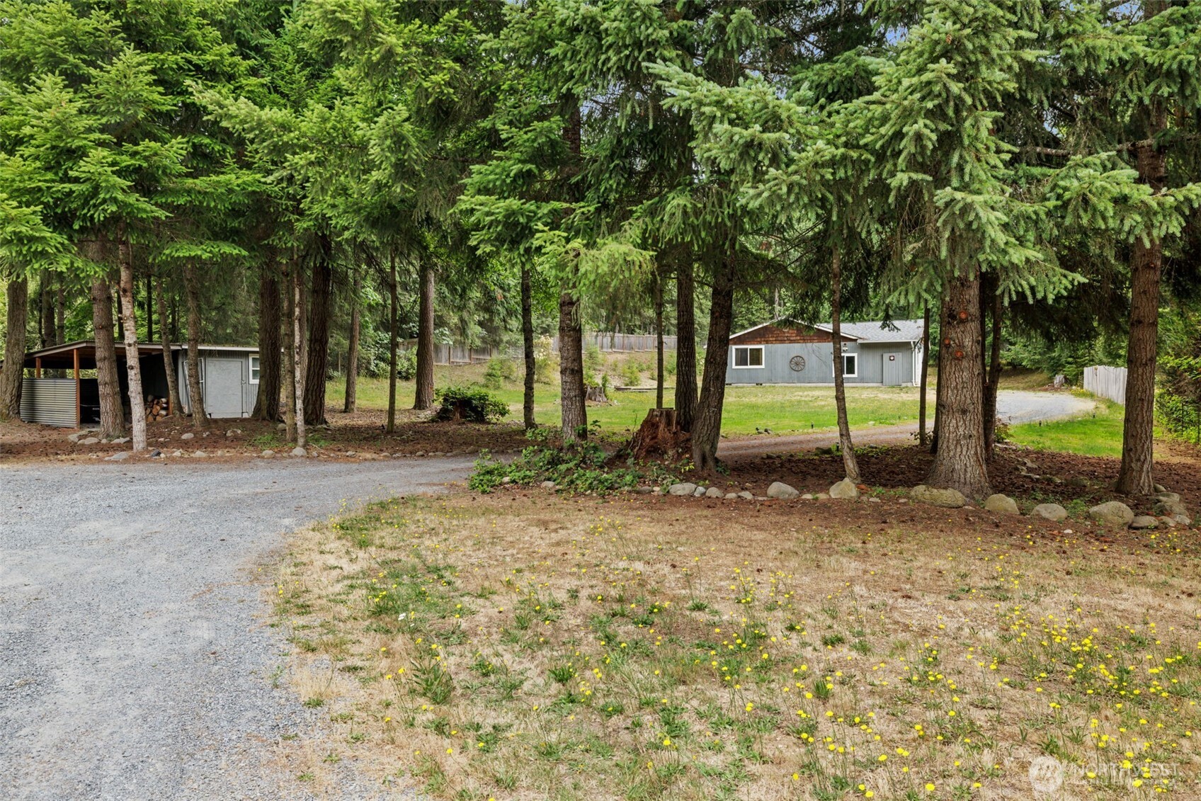 19221 Patterson Road East Orting, WA 98360 - Photo 33 of 40 a view of outdoor space with deck and trees