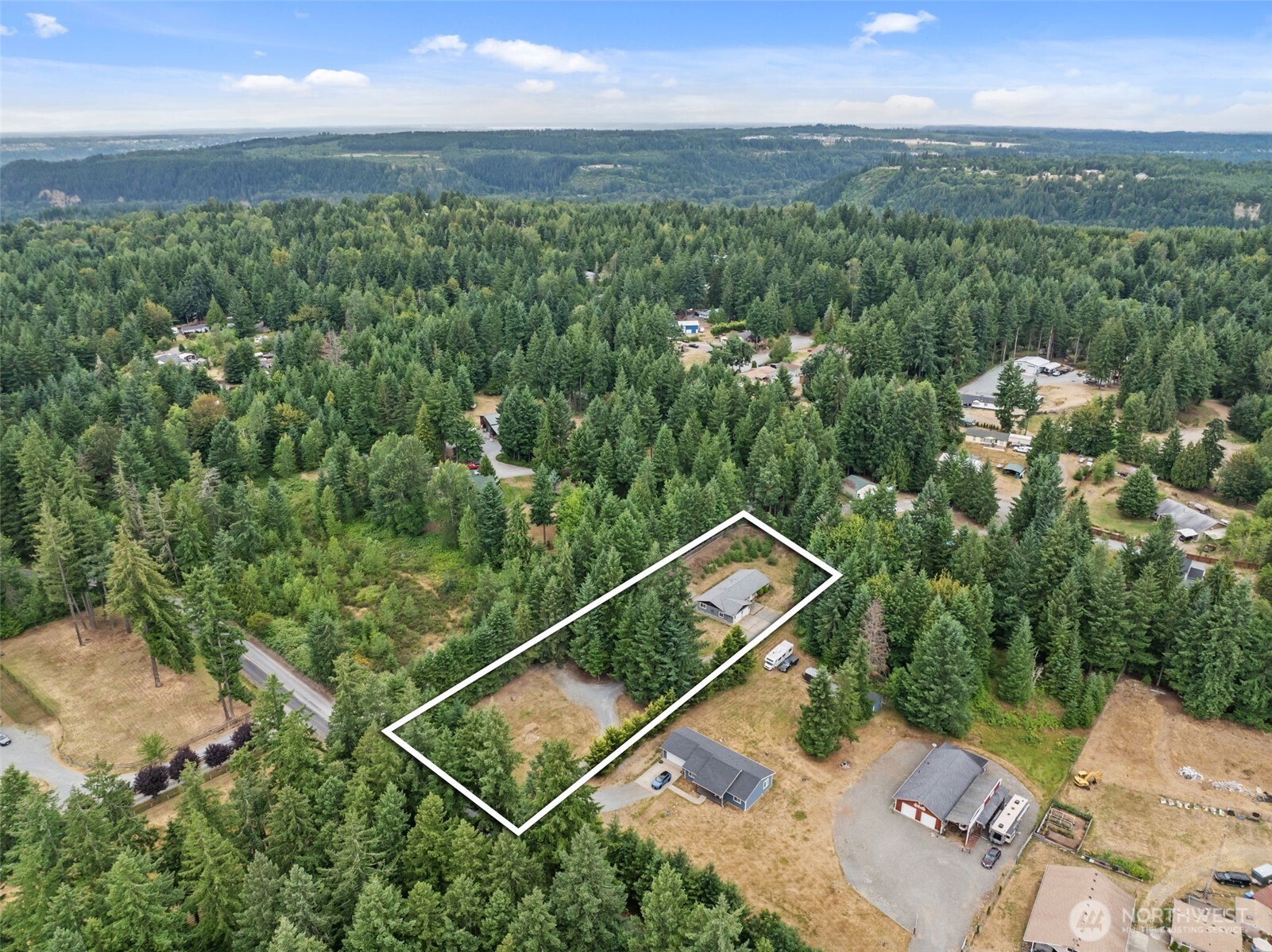 19221 Patterson Road East Orting, WA 98360 - Photo 36 of 40 a view of a city with lush green forest