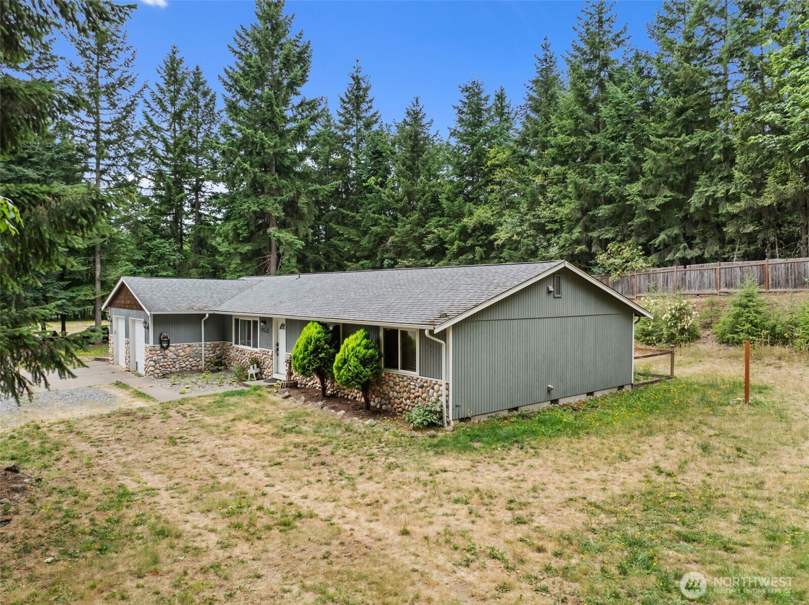 19221 Patterson Road East Orting, WA 98360 - Photo 4 of 40 a view of a house with a yard and large tree