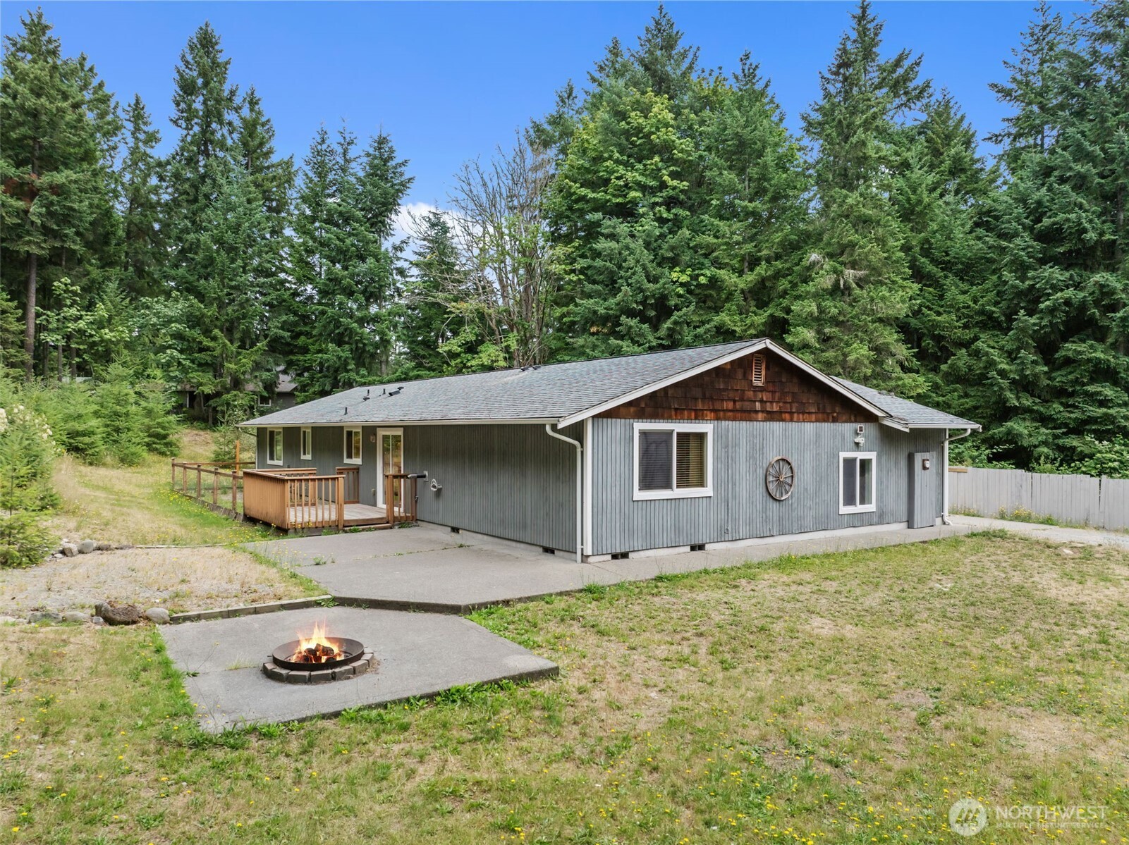19221 Patterson Road East Orting, WA 98360 - Photo 5 of 40 a view of a house with a yard and large trees