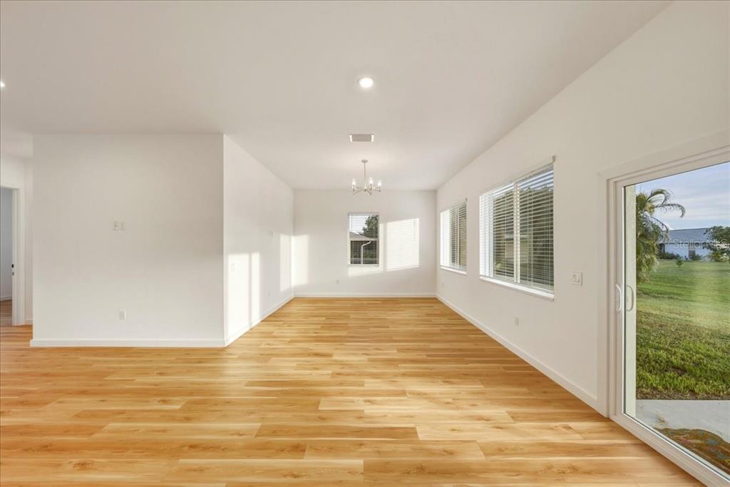 1215 Rio De Janeiro Avenue Punta Gorda, FL 33983 - Photo 22 of 65 a view of empty room with window and wooden floor