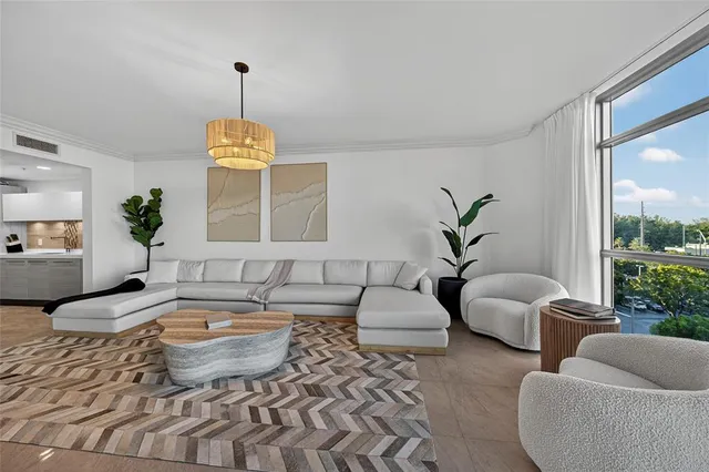 a living room with furniture and a large window