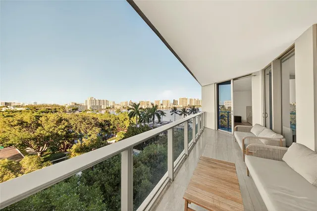 a view of balcony with furniture