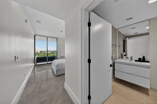 a bathroom with a tub sink and mirror