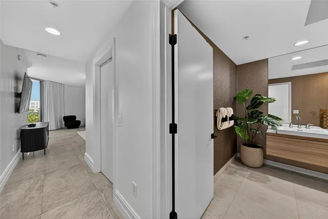 a large bathroom with a tub and shower