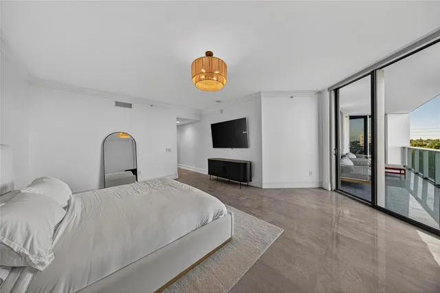 a view of a living room with walk in closet and a window