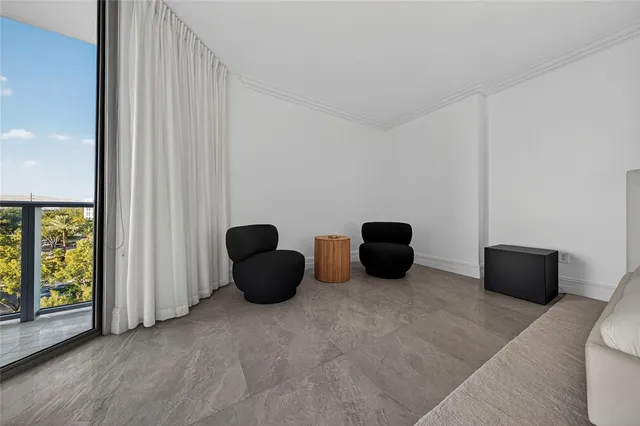a large white kitchen with a large window