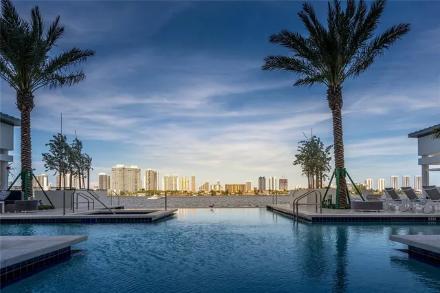 a living room with furniture and outdoor space