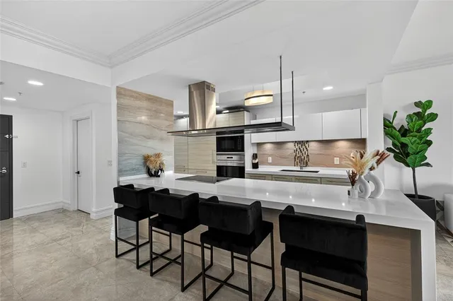 a kitchen with a table and chairs in it