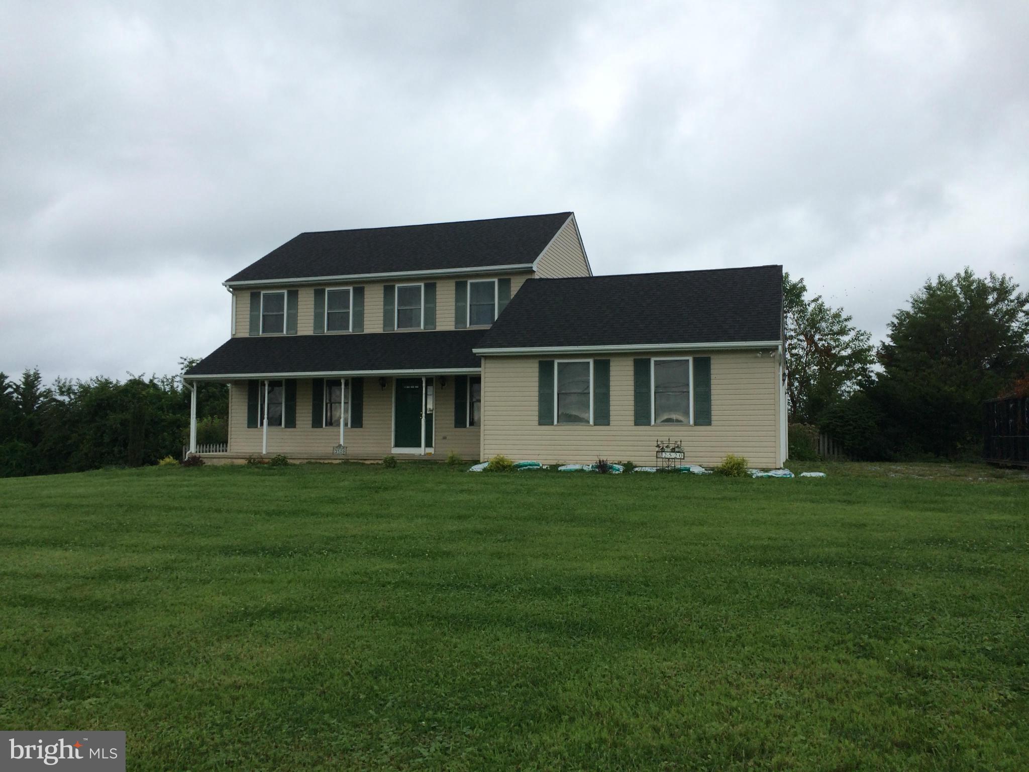 2520 Beckleysville Road Freeland, MD 21053 - Photo 1 of 5 a front view of a house with a garden