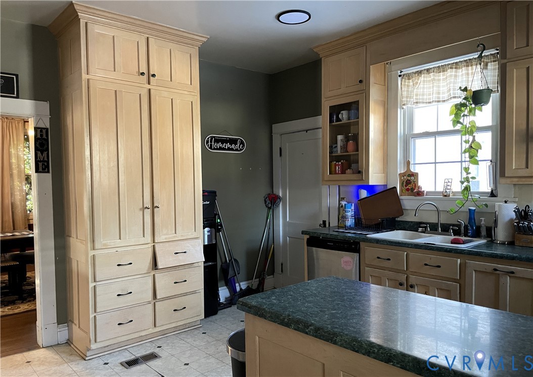 1825 Needham Drive Victoria, VA 23974 - Photo 16 of 32 a kitchen with cabinets a counter space and a window