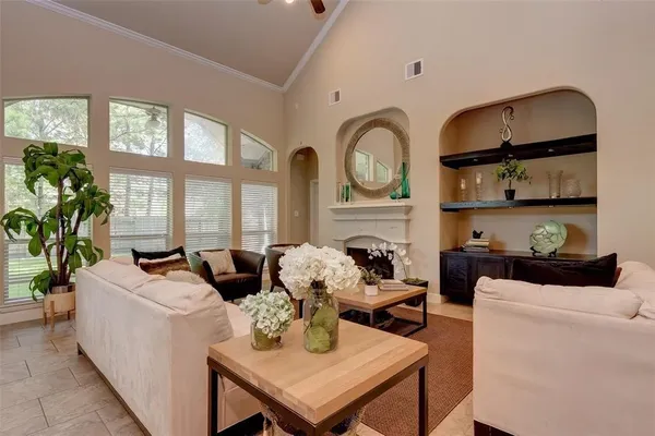 a living room with furniture a window and kitchen view