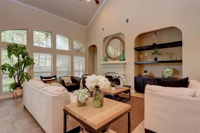 a living room with furniture a window and kitchen view