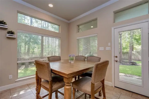 a view of a dining room with furniture window and outside view