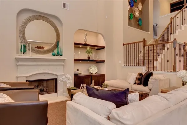 a living room with furniture and a fireplace
