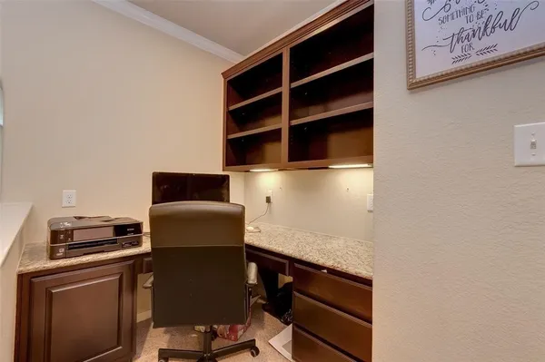 a kitchen with a refrigerator and a stove top oven