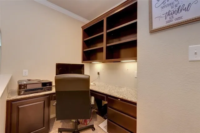 a kitchen with a refrigerator and a stove top oven