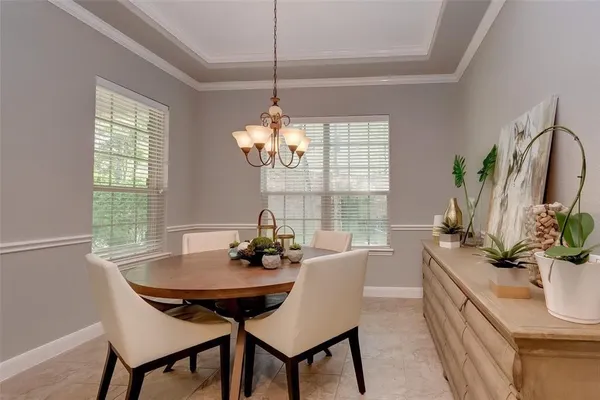 a view of a dining room with furniture window and outside view