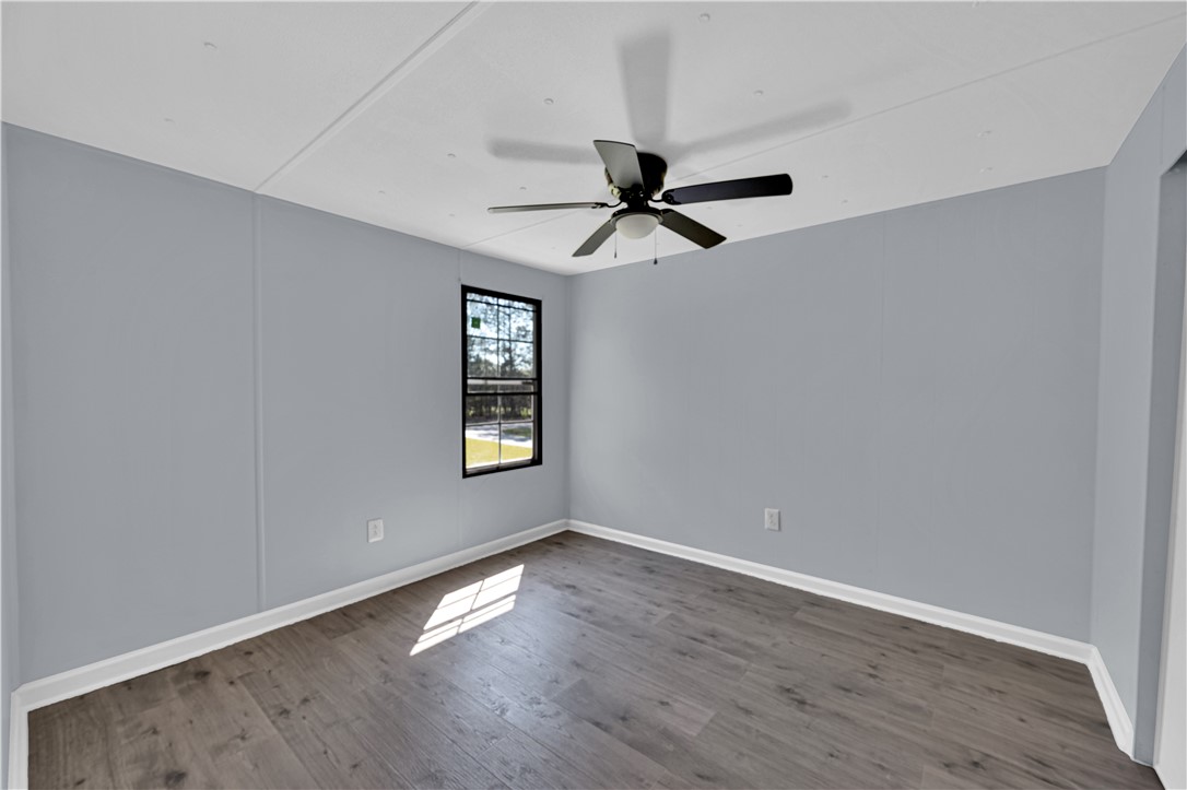 220 Bill Kay Road Belton, SC 29627 - Photo 12 of 30 This spacious room features ample natural light and durable flooring, perfect for versatile living.
