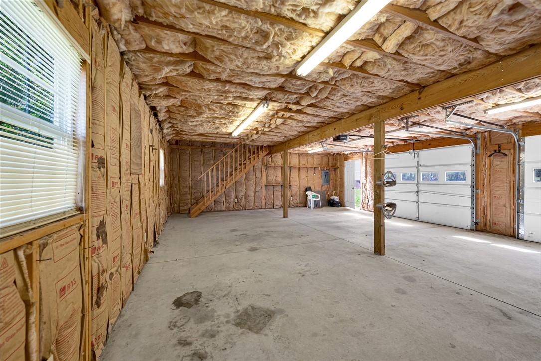 220 Bill Kay Road Belton, SC 29627 - Photo 18 of 30 Spacious garage with convenient overhead doors and a functional staircase.