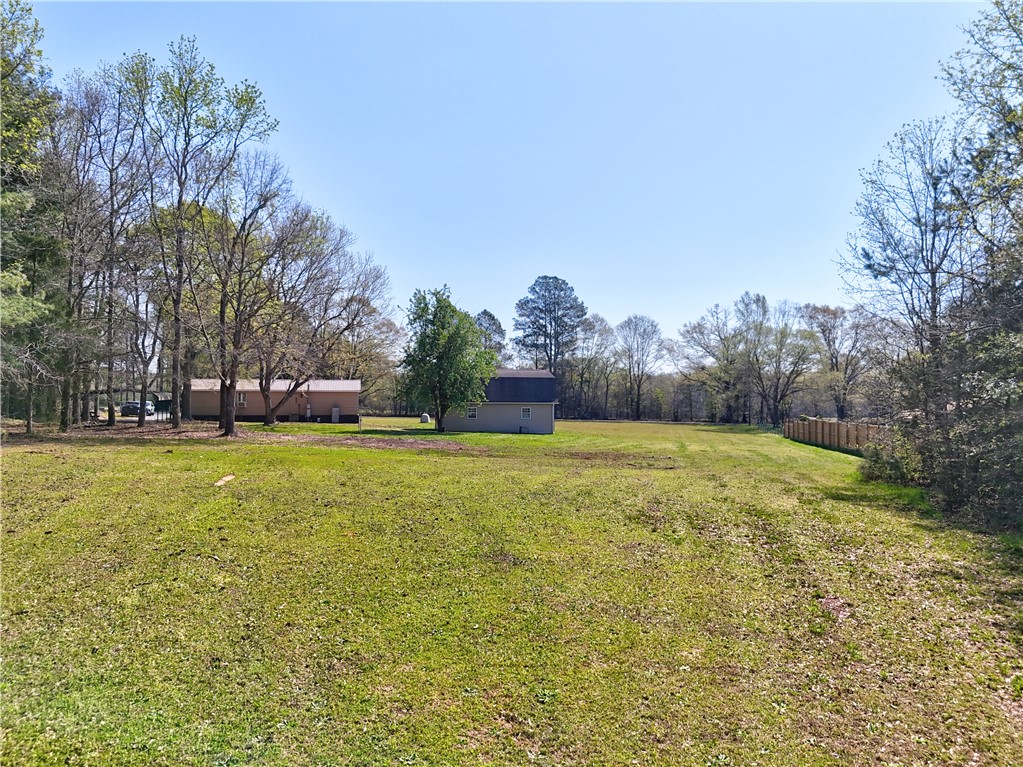 220 Bill Kay Road Belton, SC 29627 - Photo 24 of 30 Expansive green yard with mature trees, offering a private outdoor retreat.