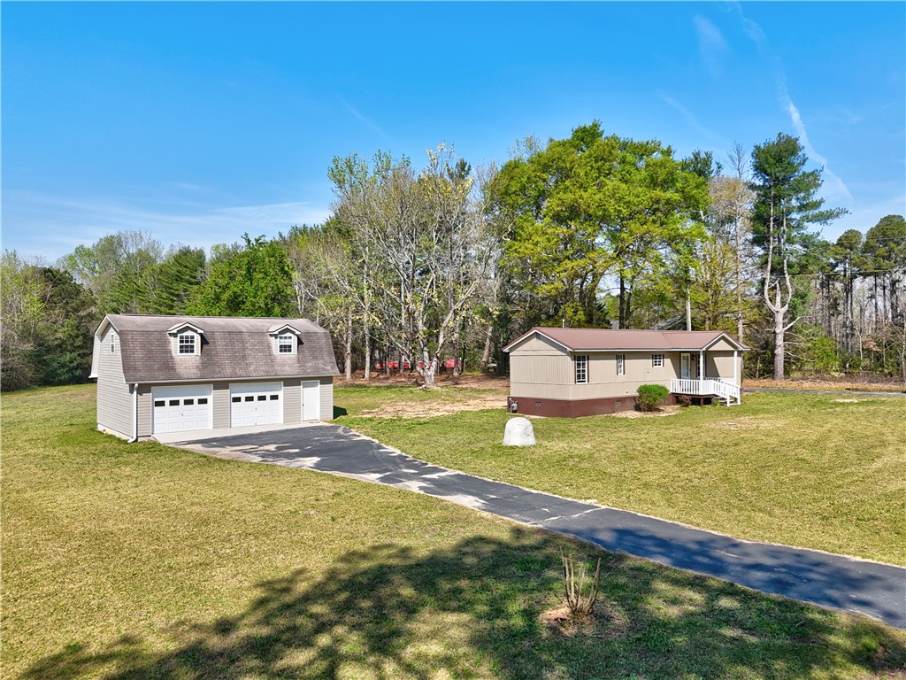 220 Bill Kay Road Belton, SC 29627 - Photo 3 of 30 This expansive property features a detached garage and ample open space.