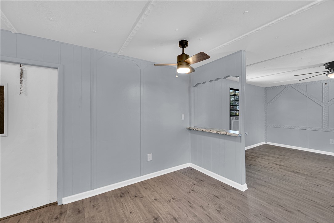 220 Bill Kay Road Belton, SC 29627 - Photo 8 of 30 This versatile interior space features durable flooring and offers a seamless flow for diverse living arrangements.