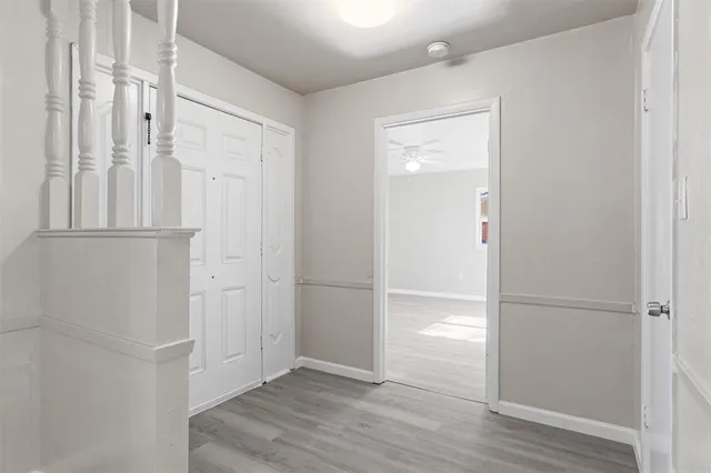 an empty room with wooden floor