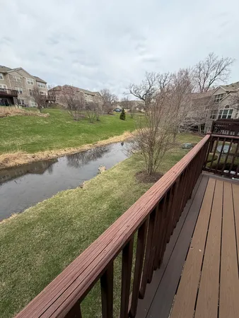 a view of a wooden deck and city view