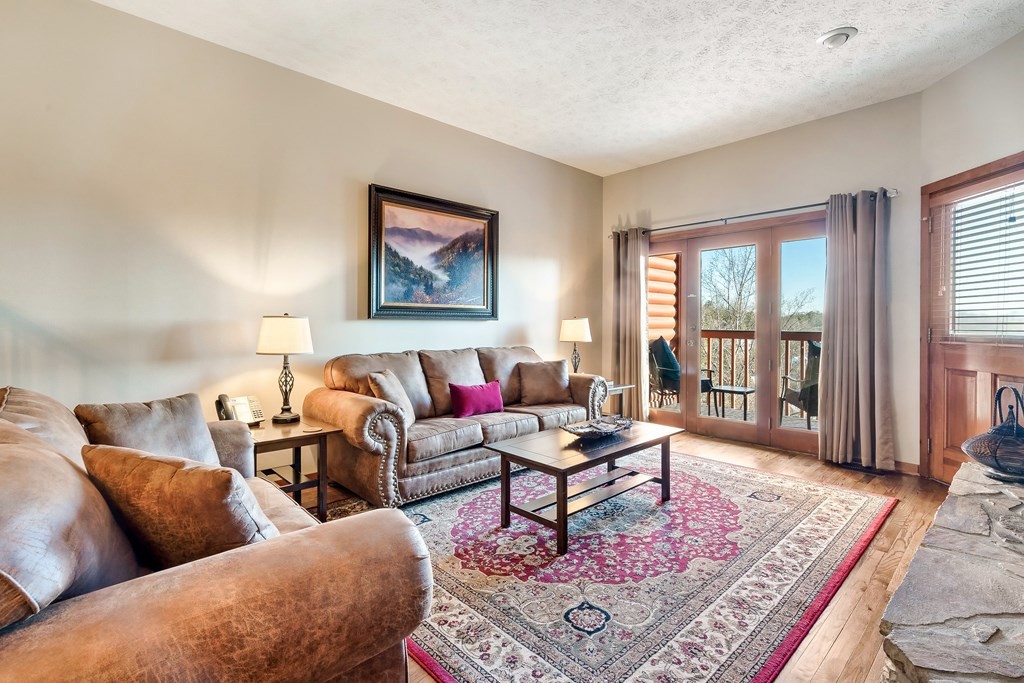 2044 Hickory Ridge Way, Unit 334 Sevierville, TN 37862 - Photo 9 of 28 a living room with furniture rug and window