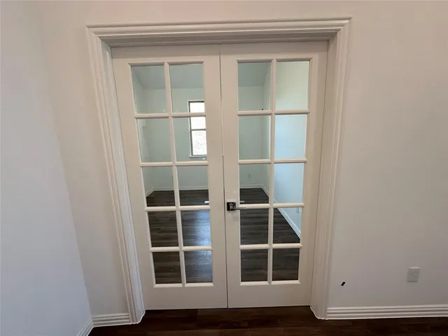 a view of wooden floor with windows