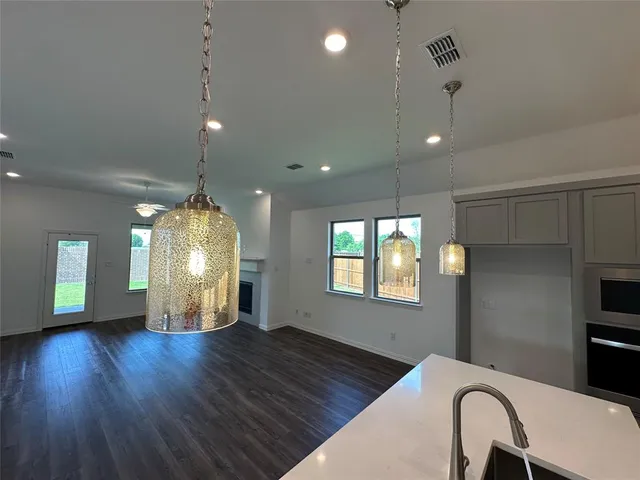 a room with wooden floor and window