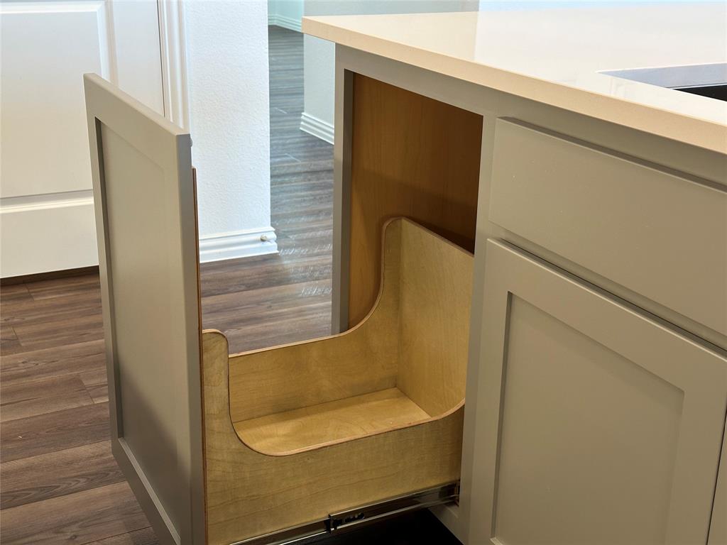 3401 Paintbrush Path Melissa, TX 75454 - Photo 25 of 39 Kitchen view of dark wood finished floors and gray cabinetry