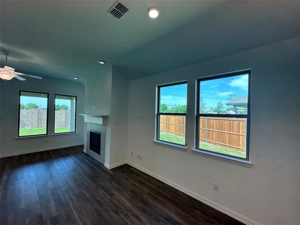 3401 Paintbrush Path Melissa, TX 75454 - Photo 26 of 39 Unfurnished living room featuring a fireplace, dark wood finished floors, a ceiling fan, and recessed lighting