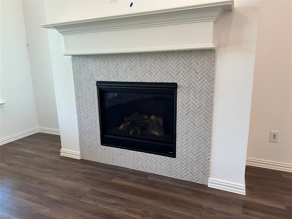 3401 Paintbrush Path Melissa, TX 75454 - Photo 27 of 39 Detailed view of wood finished floors and a fireplace