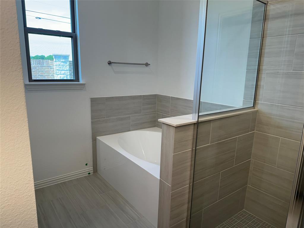 3401 Paintbrush Path Melissa, TX 75454 - Photo 35 of 39 Full bath featuring a bath and a tile shower