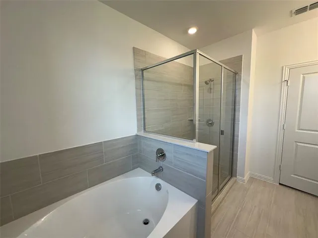 a bathroom with double sink and a mirror