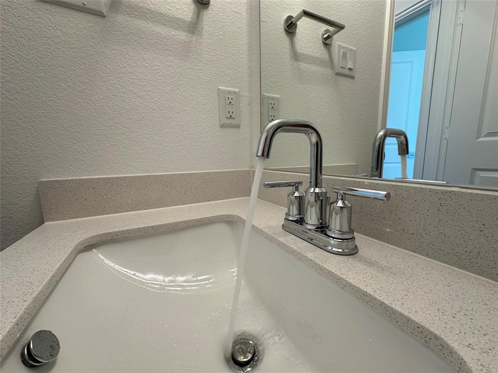 3401 Paintbrush Path Melissa, TX 75454 - Photo 9 of 39 Bathroom view of a textured wall and vanity