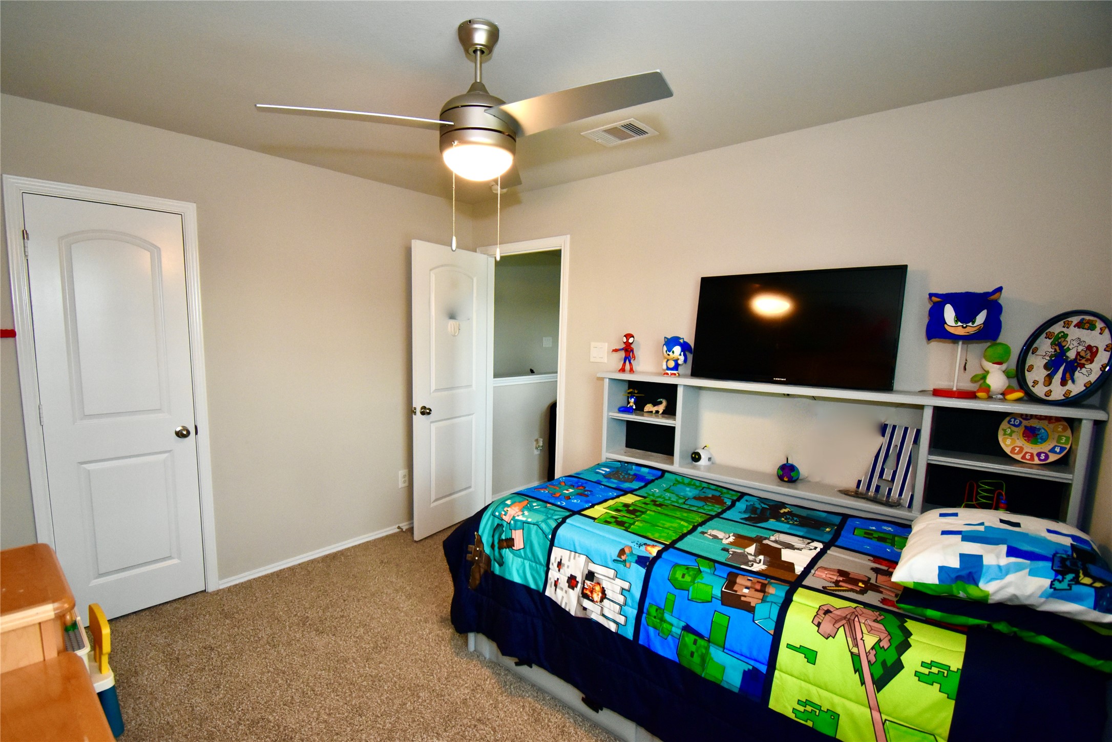 22830 Zephyr Vly Trail Spring, TX 77373 - Photo 17 of 17 a bedroom that has a bed and a table in it