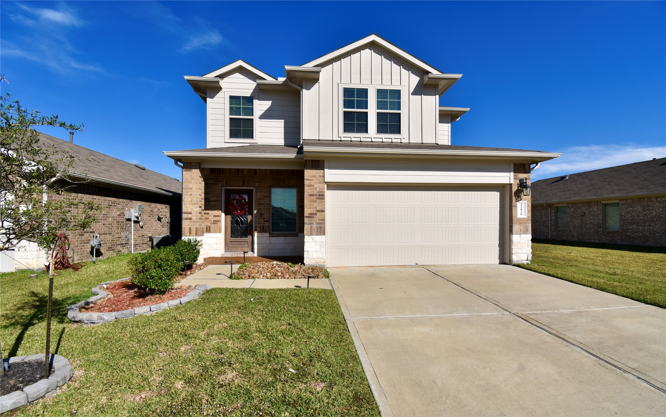 22830 Zephyr Vly Trail Spring, TX 77373 - Photo 3 of 17 a front view of a house with a yard and garage