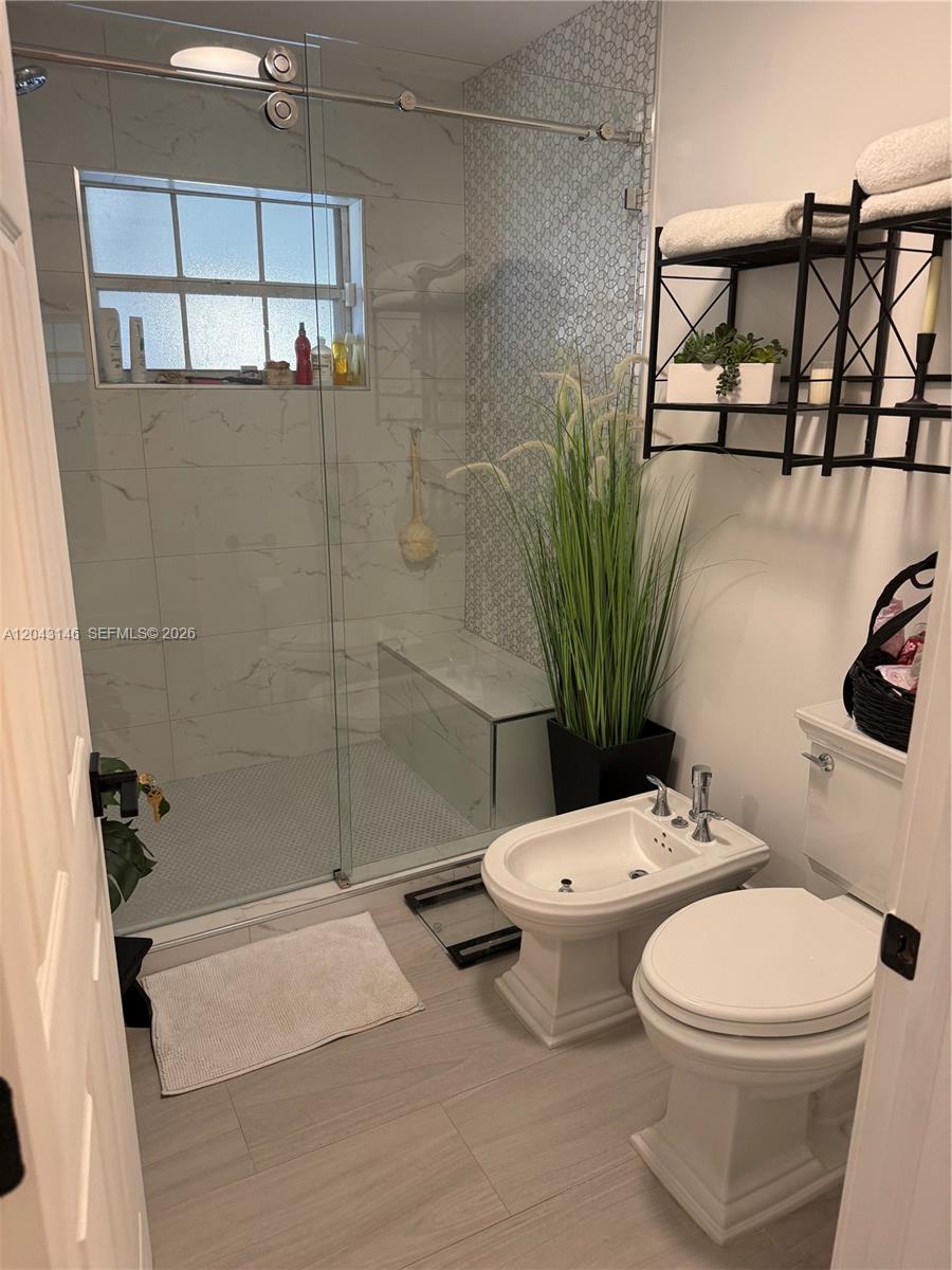 4947 Southwest 143rd Avenue Miami, FL 33175 - Photo 19 of 19 The Master bathroom has kohler bidet and toilet.
