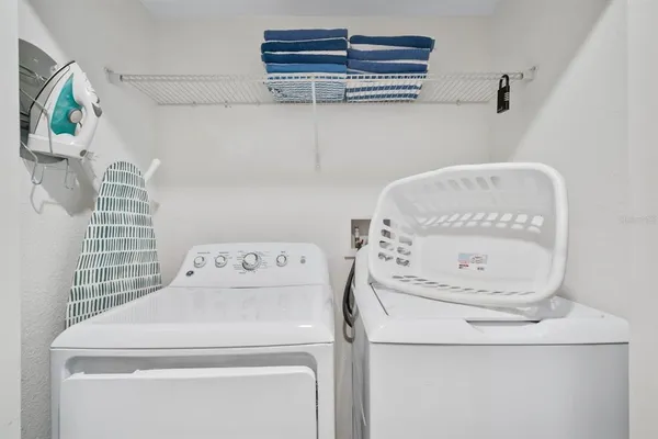 a view of a backyard with table and chairs