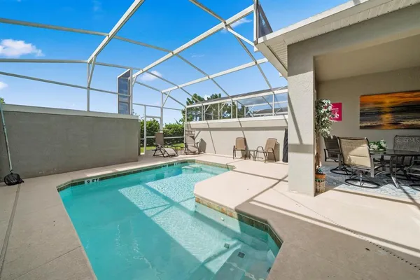 a view of a backyard with a patio and a patio