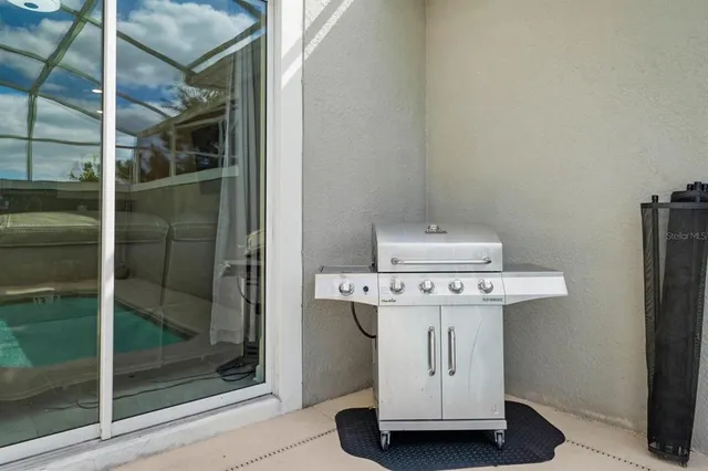 an aerial view of a house with yard swimming pool and outdoor seating