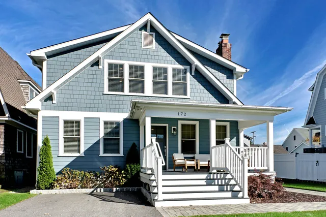 a front view of a house with a porch