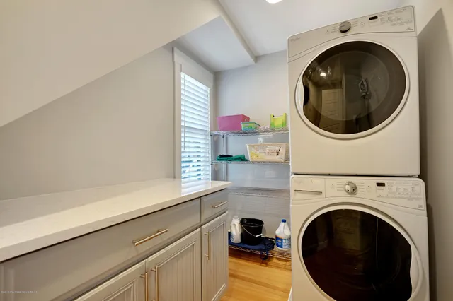 a living room with a washer and dryer