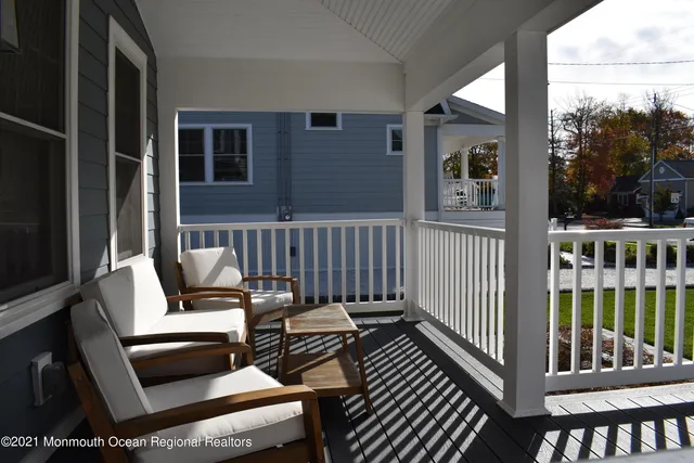 a view of a balcony with chairs