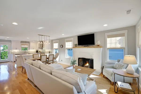 a living room with furniture fireplace and flat screen tv